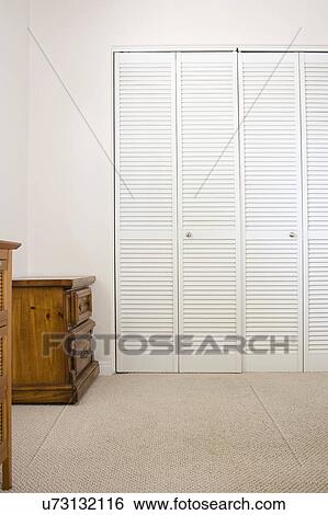 Stock Photograph - Closed doors of closet in a room, San Diego, California, United States of America. Fotosearch