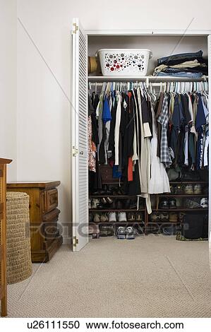 Clothes and shoes in cluttered closet, San Diego, California, United States of America View Large Photo Image Stock Image - Clothes and shoes in cluttered closet, San Diego, California, United States of America. Fotosearch