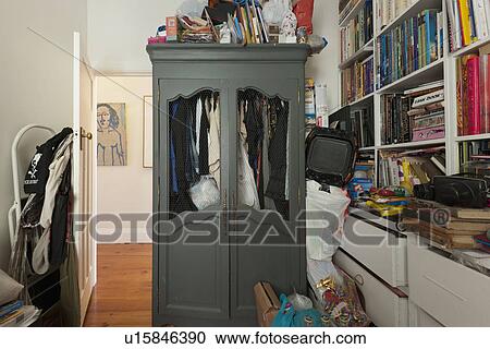 Stock Image - Cluttered room in traditional home; Sydney; Australia. Fotosearch