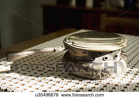 Coal hot pot on table; Italy View Large Photo Image Stock Photo - Coal hot pot on table; Italy. Fotosearch