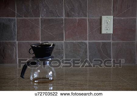 Stock Image - Coffee pot on countertop; Porterville; California; USA. Fotosearch