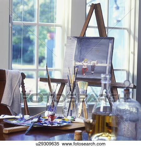 Stock Photography - COLLECTIBLES - GLASS: Old bottles used as paintbrush holders.. Fotosearch