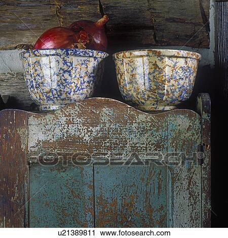 COLLECTIBLES - SPONGE WARE: Detail shot of two Sponge ware bowls on top of rustic antique cupboard. One is filled with red onions. View Large Photo Image Stock Image - COLLECTIBLES - SPONGE WARE: Detail shot of two Sponge ware bowls on top of rustic antique cupboard. One is filled with red onions. . Fotosearch