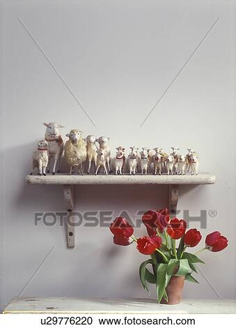 COLLECTION - Collection of handcrafted antique sheep on shelf, red tulips. View Large Photo Image Stock Image - COLLECTION - Collection of handcrafted antique sheep on shelf, red tulips. . Fotosearch
