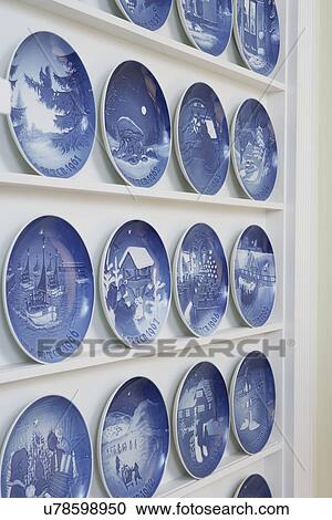 Collection Displays: Detail of shallow built in shelving unit specifically designed for displaying the blue and white Bing & Grondahl Danish Christmas plate collection. View Large Photo Image Stock Image - Collection Displays: Detail of shallow built in shelving unit specifically designed for displaying the blue and white Bing & Grondahl Danish Christmas plate collection.. Fotosearch
