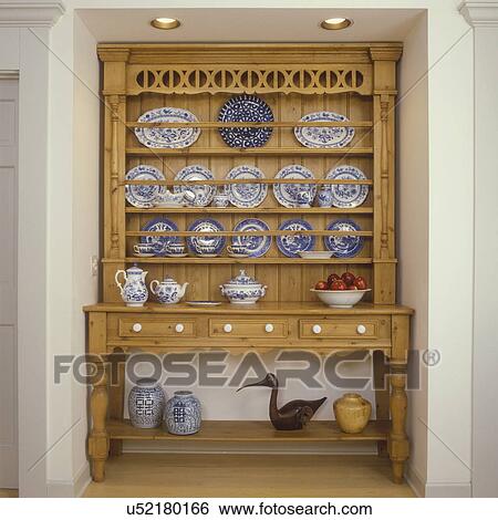 COLLECTION DISPLAYS - Kitchen detail: Pine cupboard with blue and white china, decoy, ginger jars, View Large Photo Image Stock Photograph - COLLECTION DISPLAYS - Kitchen detail: Pine cupboard with blue and white china, decoy, ginger jars, . Fotosearch