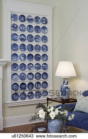 Collection Displays: Vignette of living room corner with shallow built in unit displaying the Danish Bing & Grondahl Christmas plates. Side table with lamp View Large Photo Image Stock Image - Collection Displays: Vignette of living room corner with shallow built in unit displaying the Danish Bing & Grondahl Christmas plates. Side table with lamp. Fotosearch