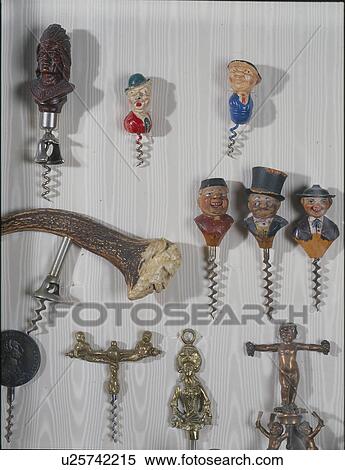 Stock Photography - Collection of corkscrews displayed on the wall. Fotosearch