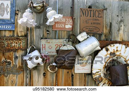 Stock Image - Collection of license plates and knick knacks on wooden fence, USA, New Mexico, Santa Fe. Fotosearch