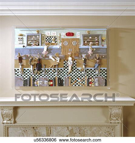 Stock Photograph - Collection of sorts made of fifty different materials mounted on plywood hanging over fireplace mantel. Fotosearch