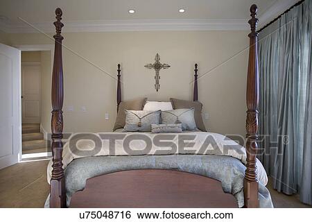 Collection of throw pillows on four-poster bed in bedroom, Laguna Beach, California, USA View Large Photo Image Stock Photograph - Collection of throw pillows on four-poster bed in bedroom, Laguna Beach, California, USA. Fotosearch