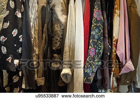 Stock Photo - Collection of woman's clothing hanging in closet; Irvine; California; USA. Fotosearch