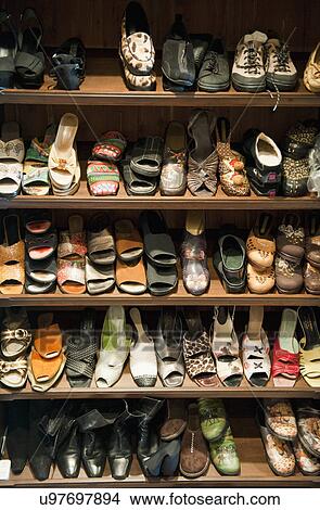 Picture - Collection of Woman's shoes on shelf; Irvine; California; USA. Fotosearch