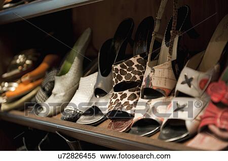 Collection of Woman's shoes on shelf; Irvine; California; USA View Large Photo Image Stock Photography - Collection of Woman's shoes on shelf; Irvine; California; USA. Fotosearch