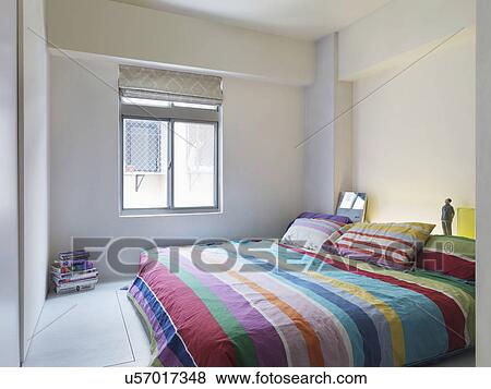 Colorful bedspread on platform bed View Large Photo Image Stock Photo - Colorful bedspread on platform bed. Fotosearch