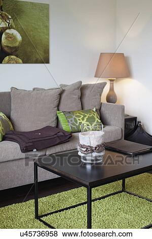 Comfortable sofa with cushions and table lamp in living room View Large Photo Image Stock Photo - Comfortable sofa with cushions and table lamp in living room. Fotosearch