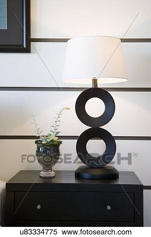 Contemporary bedside table with lamp; Oxnard; California; USA View Large Photo Image Stock Photography - Contemporary bedside table with lamp; Oxnard; California; USA. Fotosearch