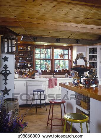 Stock Photography Of Country Kitchen Island With Wood Countertop Stock Photography Of Country Kitchen Island With Wood Countertop Metal Primary Colored Stools Tongue And Groove Ceiling Antiques Crock Scale