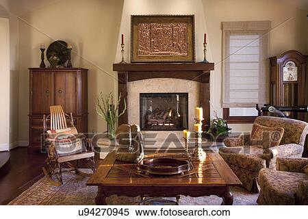 Stock Photography - Cozy living room centered around fireplace, Laguna Beach, California, USA. Fotosearch