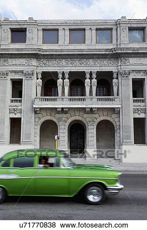 Cuban architecture with old green American car, Havana, Cuba View Large Photo Image Stock Photo - Cuban architecture with old green American car, Havana, Cuba. Fotosearch