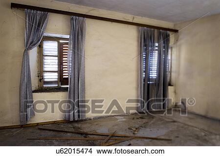 Picture - Curtains in front of window in abandoned home, Albiano d'Ivrea, Italy. Fotosearch