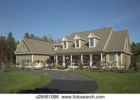Stock Photograph - Curving driveway in front of single family home. Fotosearch