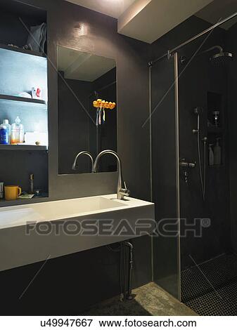 Stock Photo - Dark modern bathroom; Taipei; Taiwan. Fotosearch