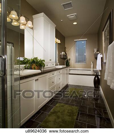 Stock Photograph - Dark tile floor in contemporary master bathroom; Aliso Viejo; California; USA. Fotosearch