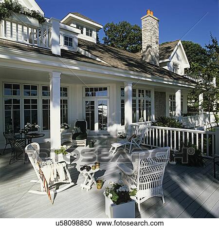 Deck - Battleship grey paint protects south facing deck, white wicker furniture, white house, white geraniums, window box, vintage sand pails, props. View Large Photo Image Stock Image - Deck - Battleship grey paint protects south facing deck, white wicker furniture, white house, white geraniums, window box, vintage sand pails, props.. Fotosearch
