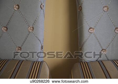 Stock Photograph - Decorative chairs with striped seats and blue chair backs; Victorville; California; USA. Fotosearch