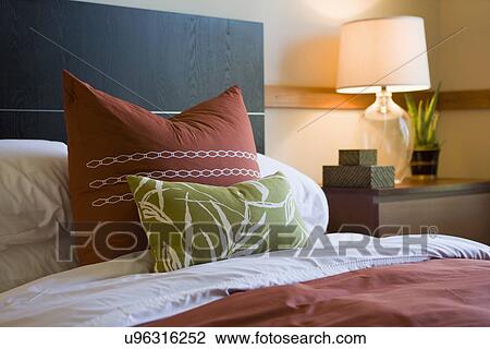 Decorative pillows on contemporary bed; Oxnard; California; USA View Large Photo Image Stock Image - Decorative pillows on contemporary bed; Oxnard; California; USA. Fotosearch