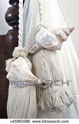 Decorative shells on tassel, Mykonos, Greece View Large Photo Image Stock Photograph - Decorative shells on tassel, Mykonos, Greece. Fotosearch