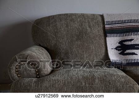 Stock Photo - Detail arm of comfy sofa; Porterville; California; USA. Fotosearch