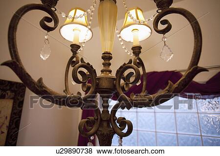 Stock Photo - Detail chandelier with lampshades; Seal Beach; California; USA. Fotosearch