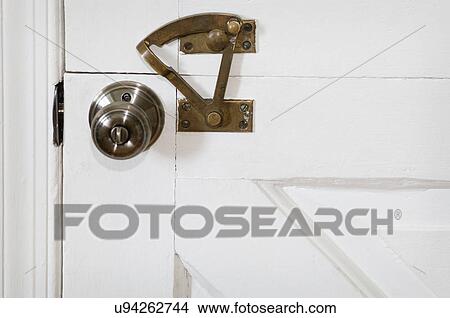 Detail doorknob and lock on Dutch door; Potomac; Maryland; USA View Large Photo Image Picture - Detail doorknob and lock on Dutch door; Potomac; Maryland; USA. Fotosearch