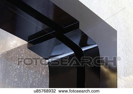 Stock Image - Detail edge of black frame surrounding mirror. Fotosearch