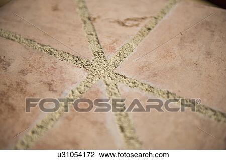 Stock Image - Detail grout between terra cotta tiles; Irvine; California; USA. Fotosearch