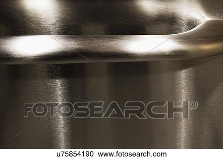 Stock Image - Detail handle of stainless steel appliance; Aliso Viejo; California; USA. Fotosearch