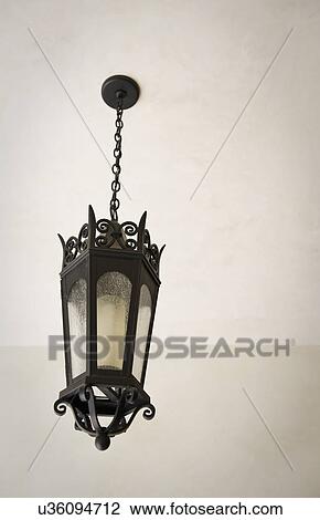 Stock Image - Detail Italianate lantern style chandelier; Irvine; California; USA. Fotosearch