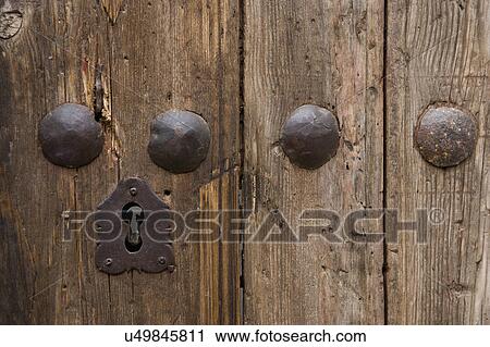 Stock Image - Detail keyhole of old wooden door; Hollywood; California; USA. Fotosearch