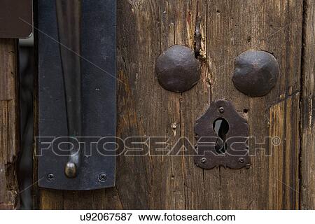 Stock Photo - Detail keyhole of old wooden door; Hollywood; California; USA. Fotosearch