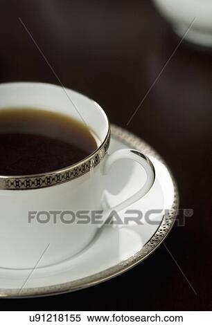 Stock Photography - Detail of coffee cup on saucer; Italy. Fotosearch