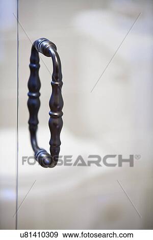 Stock Photo - Detail of handle on shower door; Irvine; California; USA. Fotosearch