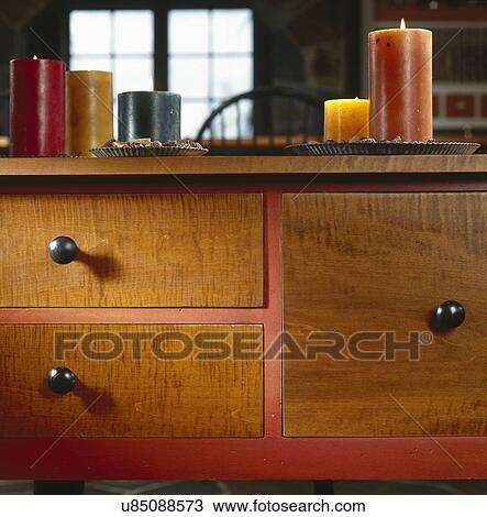 Detail of kitchen cabinet with lit candles View Large Photo Image Stock Image - Detail of kitchen cabinet with lit candles. Fotosearch
