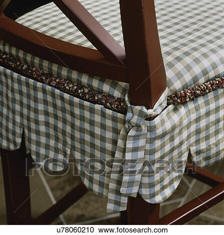 Detail of skirted chair cushion with blue and light brown checkered pattern, fringe, scalloped edge View Large Photo Image Stock Image - Detail of skirted chair cushion with blue and light brown checkered pattern, fringe, scalloped edge. Fotosearch