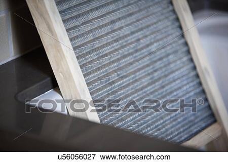 Stock Photo - Detail of washboard in sink; Irvine; California; USA. Fotosearch