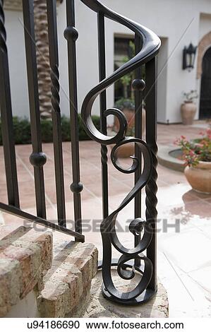 Stock Image - Detail of wrought iron banister; Irvine; California; USA. Fotosearch
