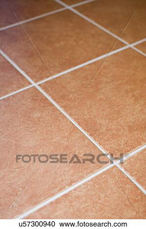 Stock Image - Detail red ceramic tiled floor; Italy. Fotosearch