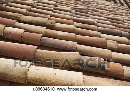 Stock Image - Detail red tile roof. Fotosearch