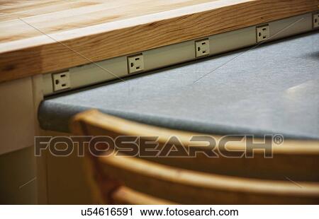 Detail row of plugs beneath countertop View Large Photo Image Stock Image - Detail row of plugs beneath countertop. Fotosearch